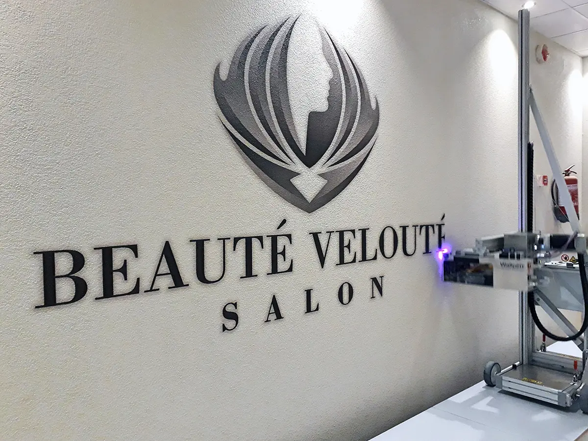 Salon logo on textured wall